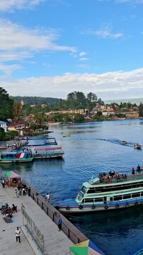 Local charter boats for inter-island crossings on Lake Toba carrying tourists, passengers and cargo. The ship travels from Parapat to the island of Samosir.