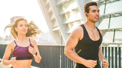 Couple, earphones and run in city for fitness, cardio or club with audio or podcast. Technology,...