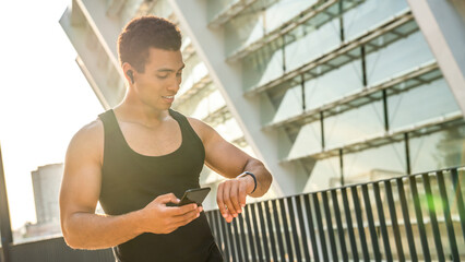 Man, fitness and running with smart watch in city for workout app, exercise or tracking...