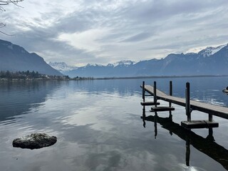 lake and mountains with boat dock 