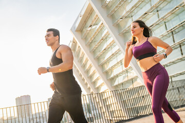 Fitness, friends and running in city for health, body wellness and training in low angle. Team,...
