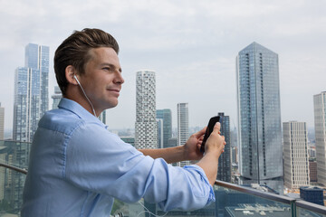 Businessman on his commute to work listening to a podcast