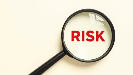 Magnifying Glass Highlighting the Word 'RISK'
