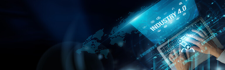 Businessman uses laptop and Industry 4.0 enhances productivity through automation, real-time data,...