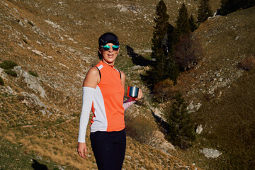 Female Hiker Preparing for a Climb to Conquer a Mountain Peak.