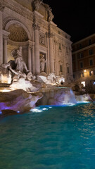 view of trevi fountain by night in rome