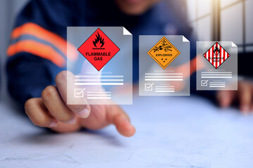 Flammable gas and hazardous substance concept with safety staff pointing on document detail for...