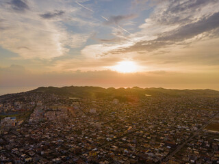 High-angle drone view of Durrës, Albania, captured during golden hour at sunset. 