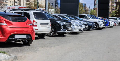 Cars parked in a row in a city parking lot