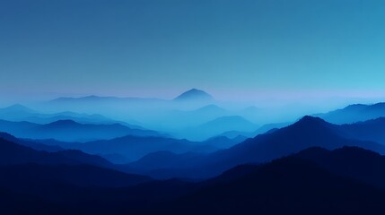 Enigmatic Blue Hues: A Misty Mountain Panorama at Dusk