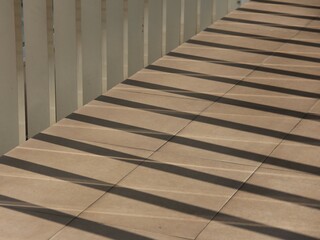 The walls are made with gaps. So that it allows sunlight to enter as natural lighting in the room.