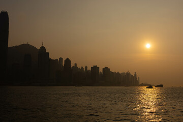 Sunset over Victoria Harbour – Silhouetted Hong Kong Skyline and Boats