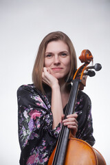 Woman in floral robe holding cello © HD92