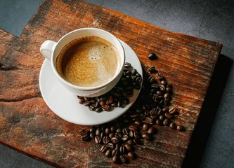  Coffee cup and coffee beans on gray background,  Espresso coffee cup aromatic on a wooden tray © NARONG