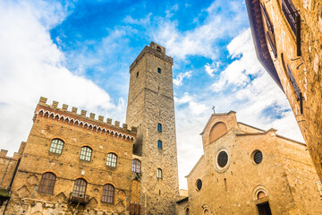 Scenic view of San Gimignano in Tuscany, Italy, highlighting its iconic medieval towers, stone...