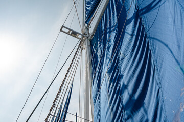 A captivating point-of-view shot capturing the view of the majestic Phinisi sail from onboard. The...