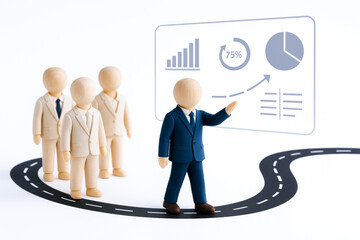 Group of wooden figurines dressed business suits are standing curved road with figure dark suit presenting data transparent screen. scene depicts agile leadership and concept of guiding teams