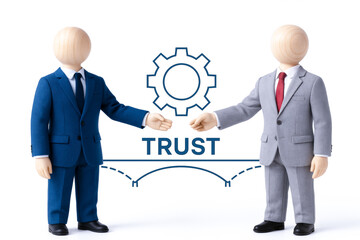 Two puppet figures business suits shaking hands with gear icon and word trust between them, representing collaboration and confidence leadership and concept of trust professional relationships