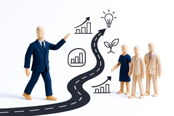 Group of wooden mannequins with person in suit presenting concept of growth and innovation, emphasizing leadership and agility in creative and professional environment