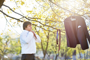 A man is getting ready for a formal event