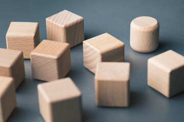 One round block among many cubes, symbolizing brand differentiation, unique value, market...