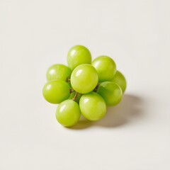 Fresh and Juicy Green Grapes Cluster on Creamy Background for Healthy Lifestyle Concept