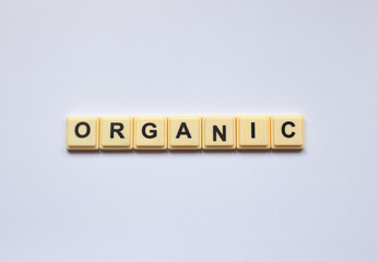 Organic word with alphabet cubes isolated on white background

