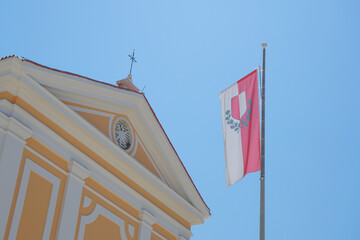 Historic Church of Our Lady of Angels in Porec, Croatia, with Croatian flag on facade, bell tower,...