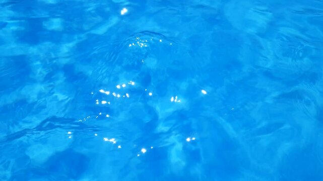 Blue water movement with top view into the pool. Relax background and texture.