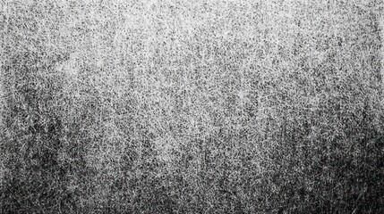 A tightly-woven, close-up shot of tangled gray fibers creating a fuzzy texture