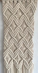 Close-up of macrame wall hanging, with diamond shapes