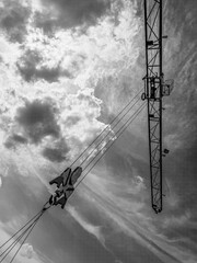 Black and white photo of a construction crane against the sky