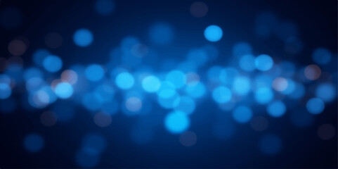 Abstract blue background with glowing defocused Christmas lights for a bright holiday celebration
