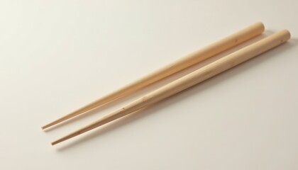 Beautifully Crafted Bamboo Chopsticks Displayed on Minimalist Background Evoking Culinary Culture and Tradition
