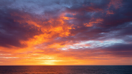 Obraz premium Sunrise sky with vibrant colors illuminating clouds over calm ocean, peaceful and inspiring atmosphere