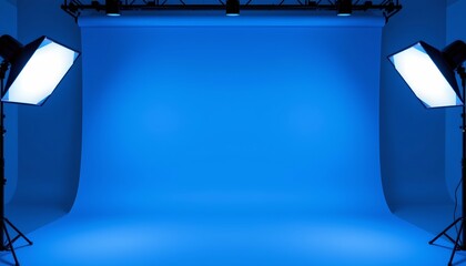 an empty video studio with a blue floor, surrounded by black walls and featuring two large video cameras on tripods at either end of the frame