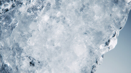 Ice pieces covered with snow in blue monochrome.