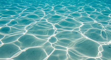 Fototapeta premium Abstract underwater sunlight patterns on a sandy seabed