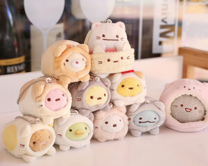 Obraz premium Pastel Plush Toy Tower Stacking Illustration, Fuzzy Stuffed Animals on Table Top View