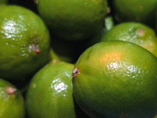 Fresh juicy green limes background