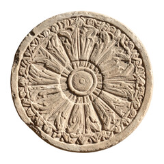Naklejka premium Ancient round stone carving with intricate radial pattern and detailed carvings around the edge, reflecting historical craftsmanship and archaeological significance