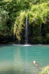 Small waterfall with lake in summer