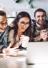 Laughing adolescents relaxing at home