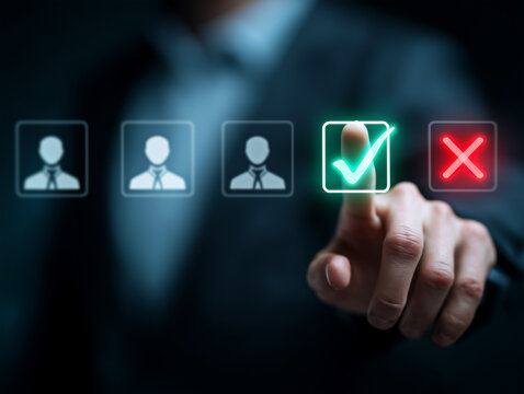 Hand selecting a candidate with a green checkmark on a digital interface