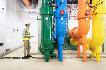 asian male engineer is working on a Cooling system pipeline
