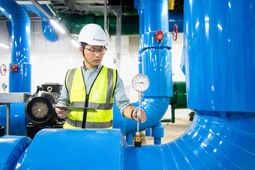 asian male engineer is working on a Cooling system pipeline
