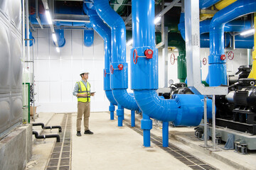 asian male engineer is working on a Cooling system pipeline