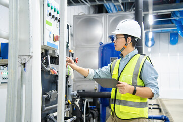 asian male engineer is working on a Cooling system pipeline