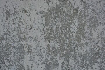 Original background, building materials, gray cement walls covered with light brush strokes with white paint.
