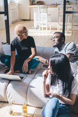 Group of cheerful friends during discussion